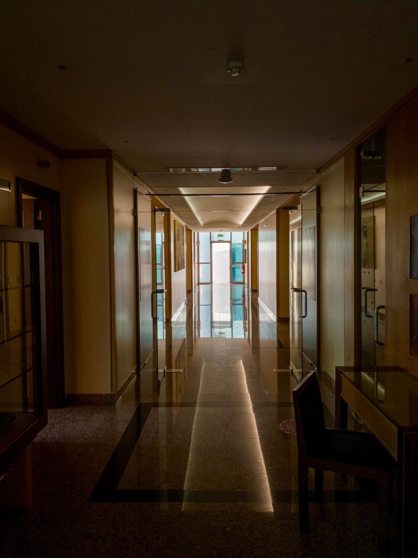 Commercial hallway with highly polished stone floors